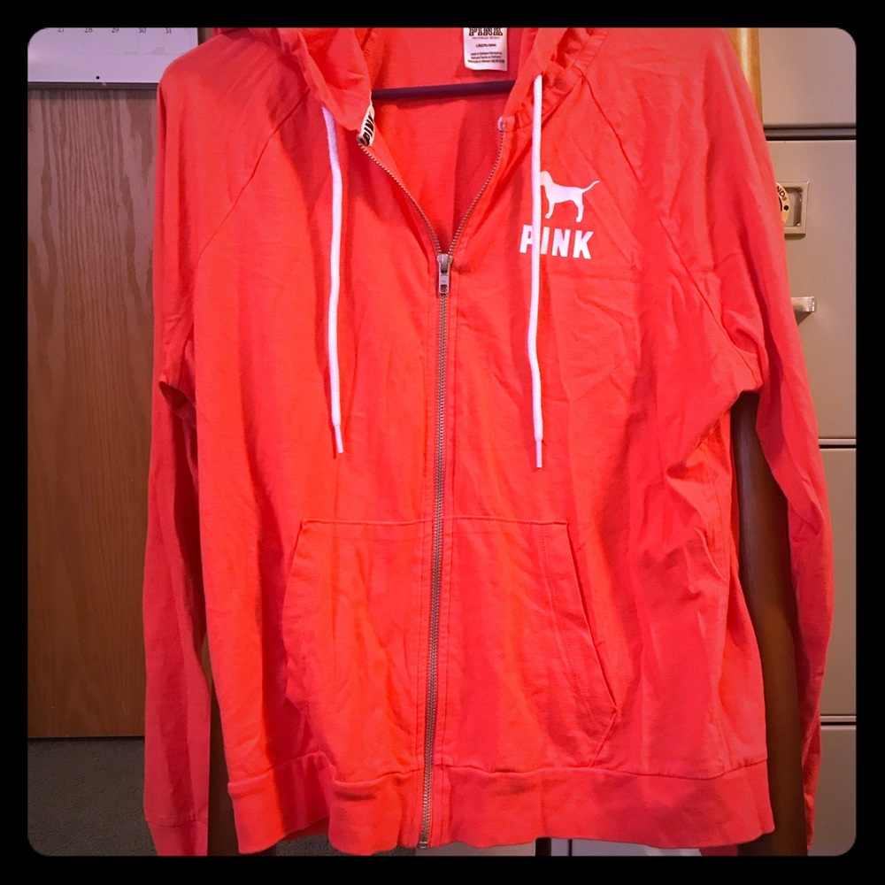 Pink zip up lightweight jacket.